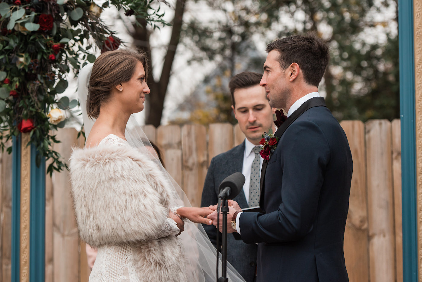 Groom putting on the Bride's wedding ring