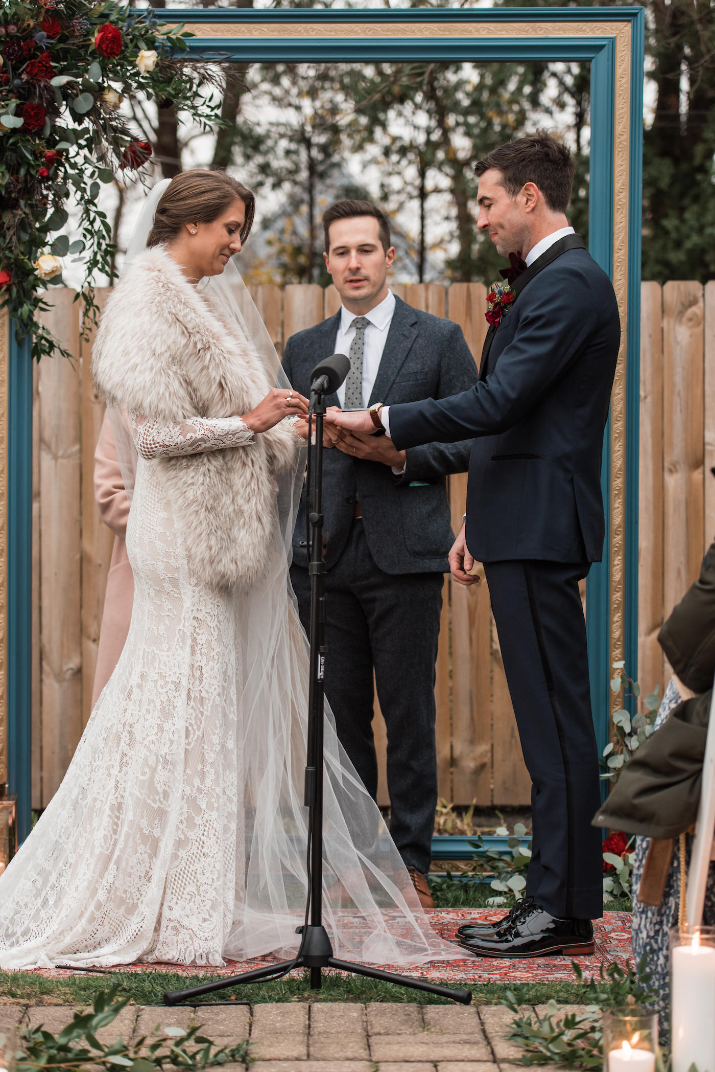 Bride putting on the Groom's wedding ring