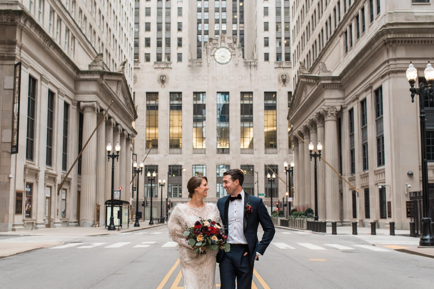 Winter wedding photos in front of Chicago's Board of Trade building